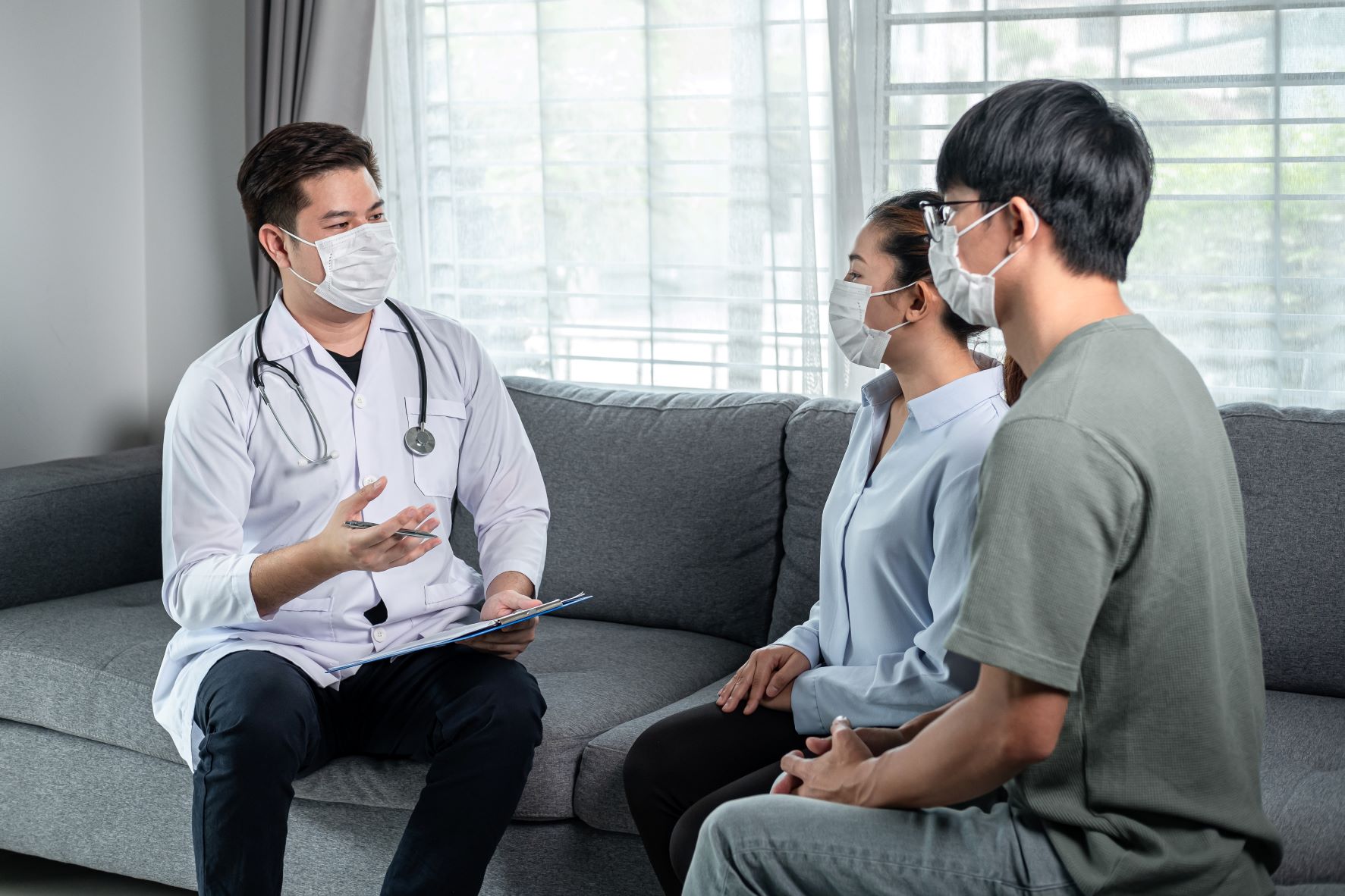 couple talking with doctor